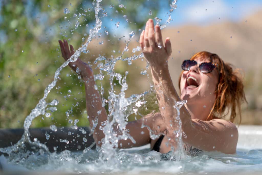 Woman splashing in Highland's Hot Tub